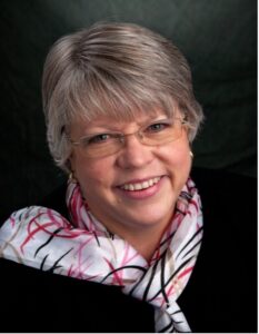 A headshot photo of Judy McMillan-Evans M.Ed.