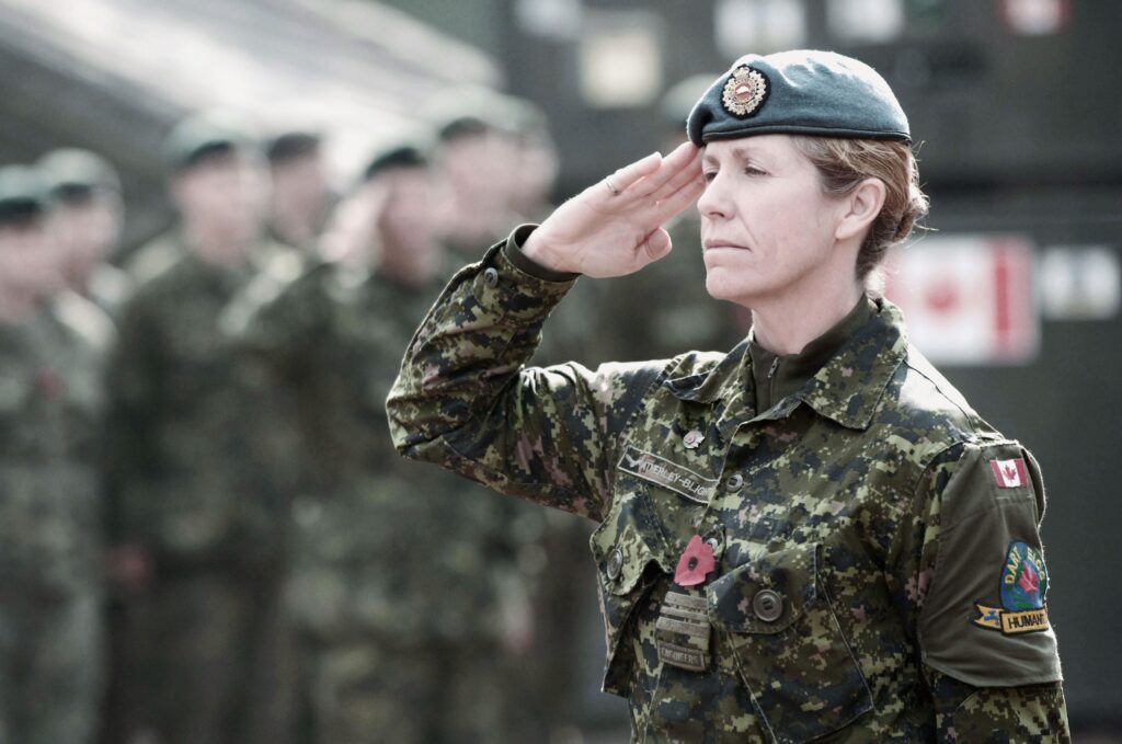 Service woman saluting.